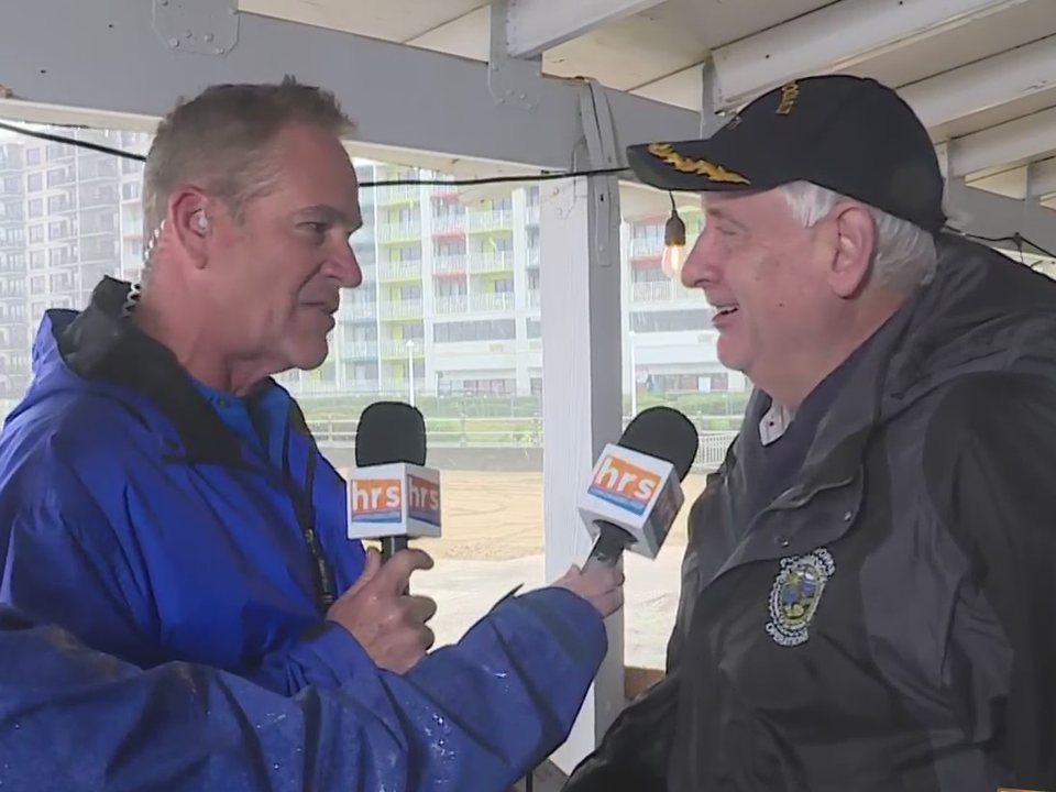 Mayor Bobby Dyer being interviewed at the Virginia Beach oceanfront